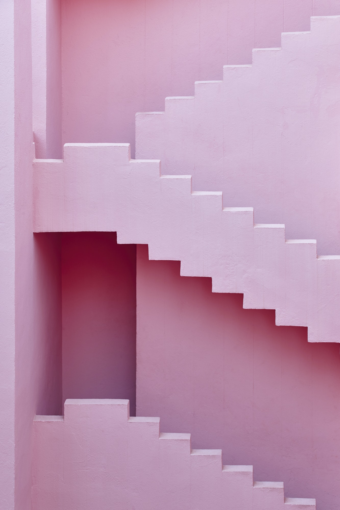 Geometric building design. The red wall, La manzanera. Calpe, Spain